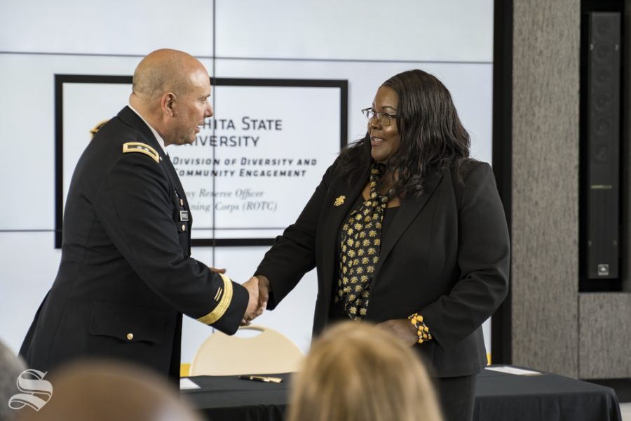 Vice President of Diversity and Community Engagement Marche Fleming-Randle shakes hands with Major General Lee Tafanelli of the Kansas Army National Guard. Fleming-Randle was instrumental in making the ROTC program happen, Tafanelli said.