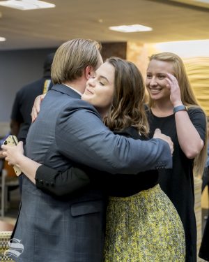 Michael Bearth hugs outgoing Student Body President Shelby Rowell after being elected student body vice president.