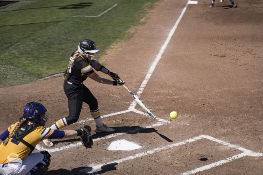 Wichita State junior Ryleigh Buck swings at a pitch during the game against ECU at Wilkins Stadium on April 19, 2019.