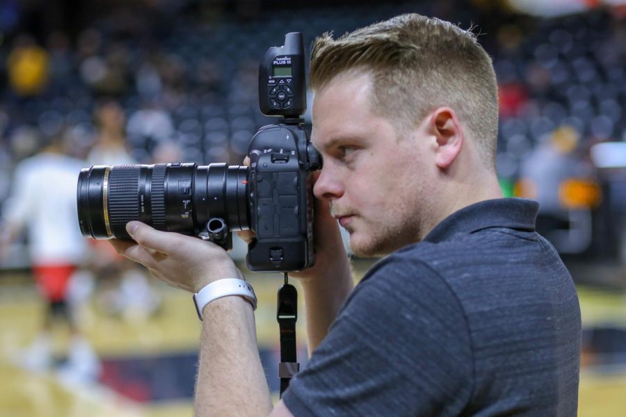 Joseph Barringhaus takes a photo for The Sunflower during warm ups before a Wichita State mens basketball game.