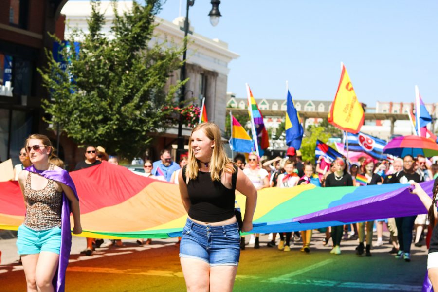 Marchers carry a giant pride flag through downtown Wichita during Wichita Pride's Unity March on Saturday, June 29.