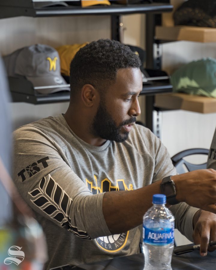 AfterShocks head coach Karon Bradley talks to a fan during the autograph signing. The event was held at Shocker Store on July 21st, 2019.