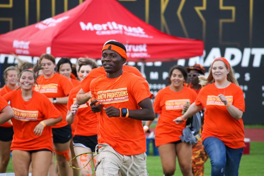 College of Health Professions students charge the field during the Clash of the Colleges on Aug. 23, 2019 at Cessna Stadium. The university is in the process of selecting the colleges next dean.