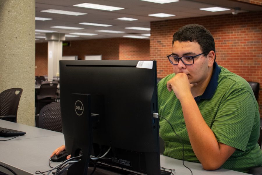 Ismail Mokaddem studies in Ablah Library on WSU's main campus. 