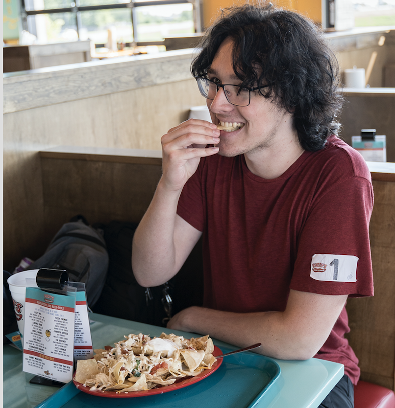 Graphic design student Christian Hurst was the first of 50 people to win free tacos for a year from WSU's new Fuzzy's Taco Shop on Innovation Campus. Hurst stood in line from 1 p.m. Sunday until the restaurant opened at 10 a.m. Monday.