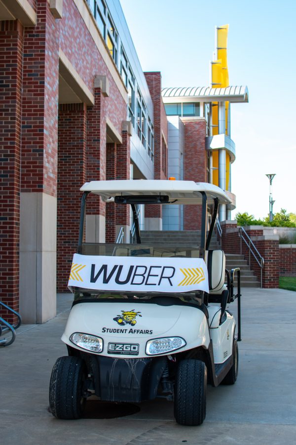 A+WUBER+golfcart+waits+outside+of+the+Rhatigan+Student+Center+on+Aug.+19.+The+WUBERs+can+be+used+for+the+first+two+days+of+the+semester+if+a+student+needs+to+get+somewhere+on+campus+in+a+hurry.