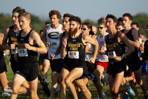 Wichita State junior Alex Moen charges forward with other Wichita State cross country members on Sept. 7 at 4 Mile Creek Resort.