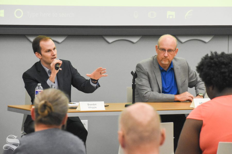 Kansas Rep. Brandon Whipple, left, and Mayor Jeff Longwell answer questions Sunday during a student-led forum for candidates in the Nov. 5 municipal elections. Whipple and Longwell are candidates for mayor of Wichita.