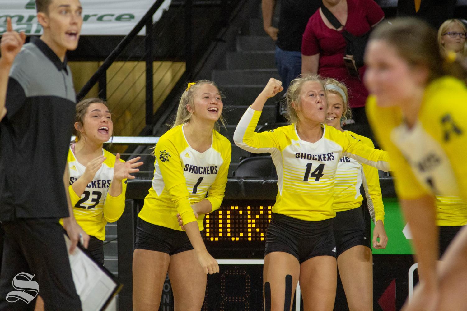 Wichita+State+freshman+Skylar+Goering+%281%29+and+junior+McKayla+Wuensch+%2814%29+celebrate+a+point+during+the+Shockers%27+home+opener+against+BYU.