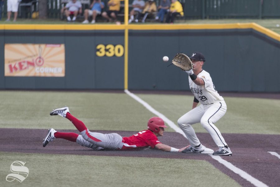 Wichita States Garrett Kocis attempts to pick off a Nebraska player during the scrimmage held at Eck Stadium on Saturday, Sept. 21, 2019.