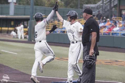 Wichita State's Jack Sigrist and Cooper Elliot celebrate after scoring runs against Nebraska during the scrimmage held at Eck Stadium on Saturday, Sept. 21, 2019.