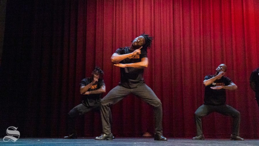 Members of Step Afrika! performing a synchronized step routine.