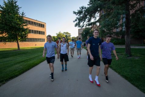 Cale Solomon, Carson Quillen, Kane Thimmesch and Garrett Chadd participate in the Walk-a-Mile event. The event raises awareness for rape, sexual assault and gender based violence on campus. The Students Activites Council and Interfraternity Council host the event.
