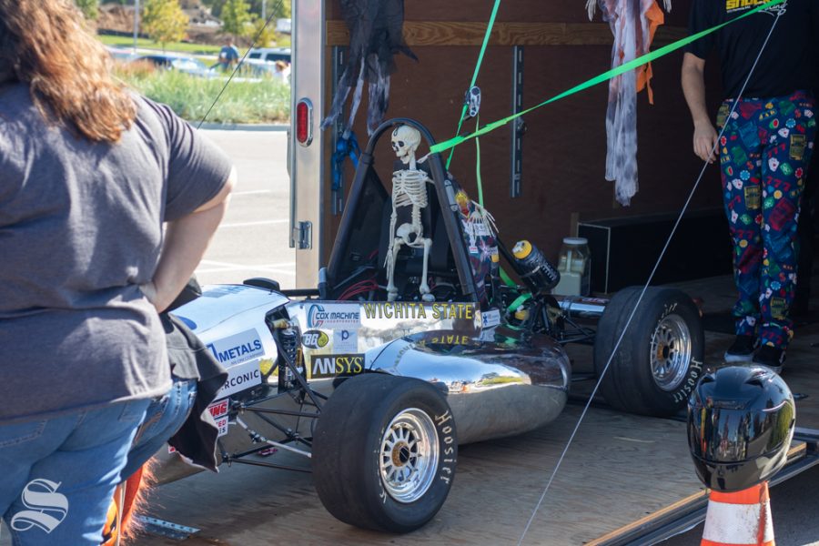The Shocker racing team gave out candy and took free photos of children inside the race car during the Trunk or Treat event on Saturday, Oct. 19 at Braeburn Square.
