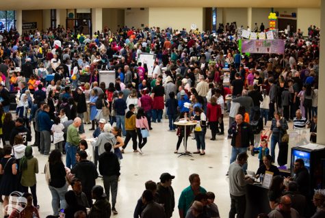 Event goers pass through the doorway from the main performance stage to the culinary section during the 39th Annual Wichita Asian Festival on Saturday, Oct. 26 at the Century II Performing Arts and Convention Center.