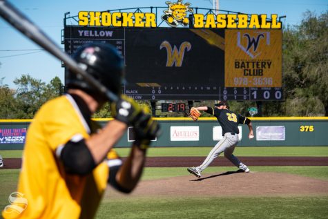 Senior Preston Snavely steps to throw a pitch to one of the yellow team players during game 5 of the Black and Yellow Fall World Series on Saturday, Oct. 19 at Eck Stadium.