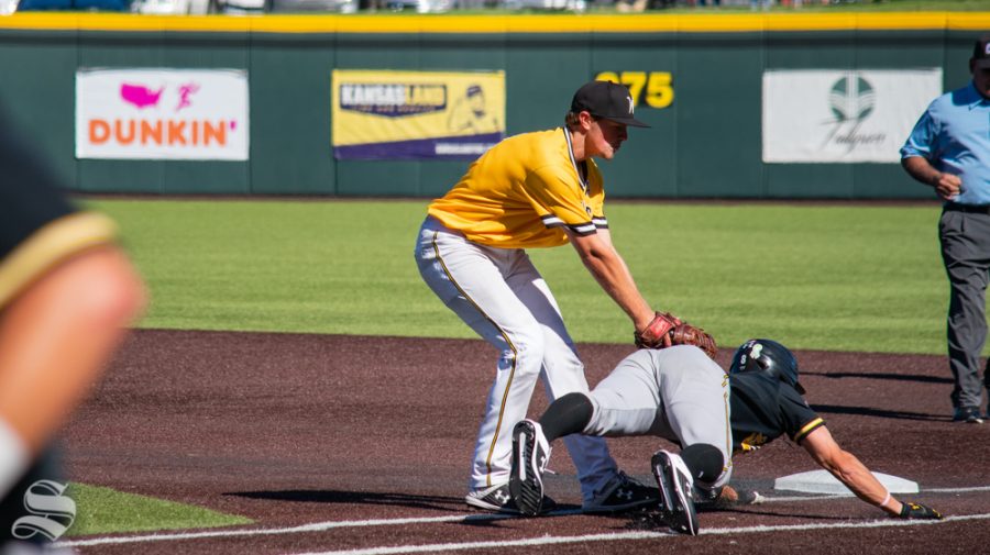 Freshman Blake Marsh tags senior Jacob Katzfey out as he approaches first during game 5 of the Black and Yellow Fall World Series on Saturday, Oct. 19 at Eck Stadium.