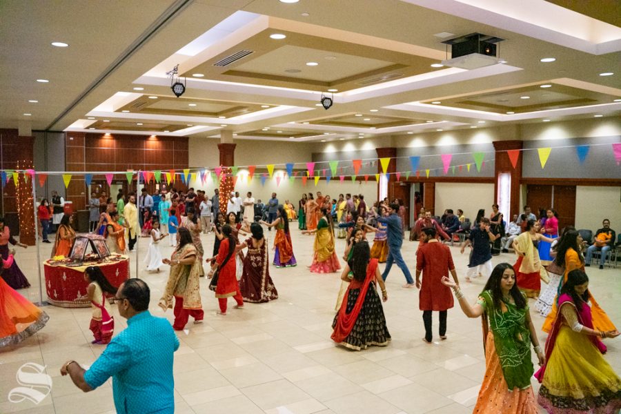 Patrons dance together during Garba Night on Oct. 5 in the Rhatigan Student Center.