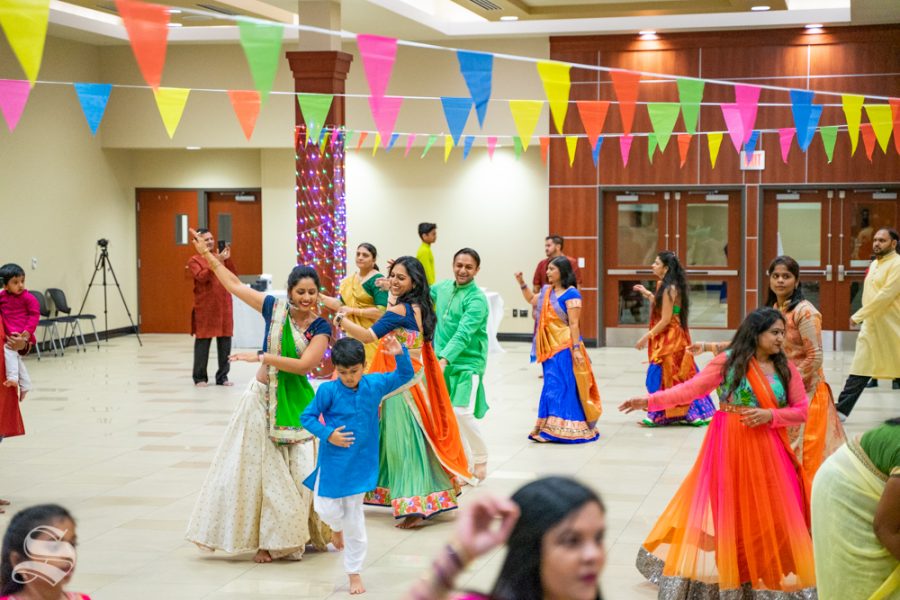 Patrons dance together during Garba Night on Oct. 5 in the Rhatigan Student Center.