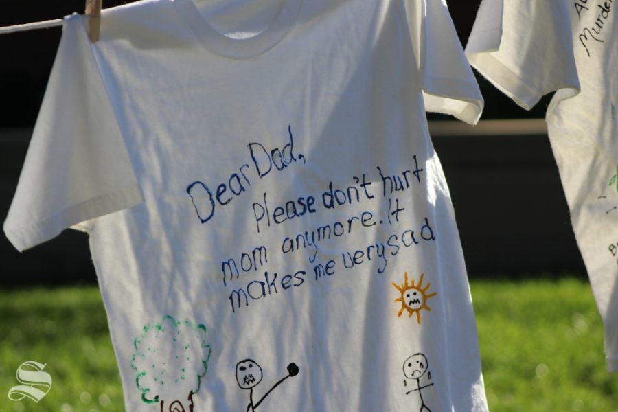This clothesline was put up along the path of Purple Mile marchers Saturday. It showed messages from kids to abusers. Sometimes kids were speaking to their parents. This t-shirt read, “Dear Dad, Please Don’t Hurt Mom Anymore. It makes me very sad.”