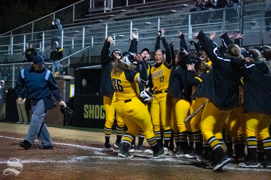 Wichita State teammates cheer for sophomore Lauren Mills after she hit a home run during their game against Kansas Univeriverity on Friday, Oct. 11 at Wilkins Stadium.