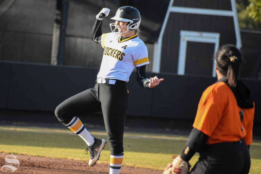 Wichita+State+senior+Bailey+Lange+celebrates+after+scoring+a+double+during+the+third+inning+of+the+game+against+Cowley+Community+College.+The+Shockers+won+21-1.