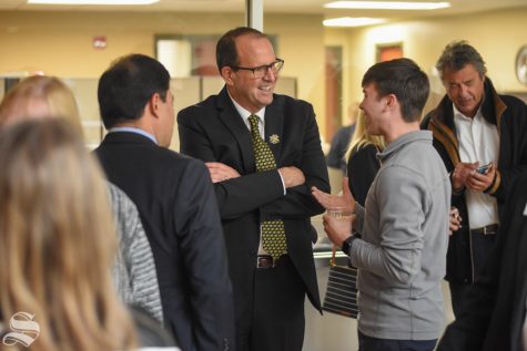 New President Jay Golden speaks to sophomore Drue Owen, a student studying history at WSU, after his public address on Thursday, Oct. 31 in the RSC.