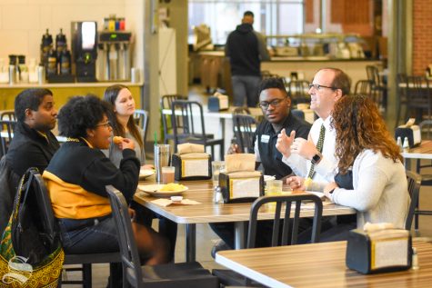 Wichita States new president Jay Golden eats breakfast on Tuesday at Shocker Hall with community stakeholders, including a group of Diversity Interns and Bobby Gandu, assistant vice president and director of undergraduate admissions. Golden was named the 14th president of WSU in October.