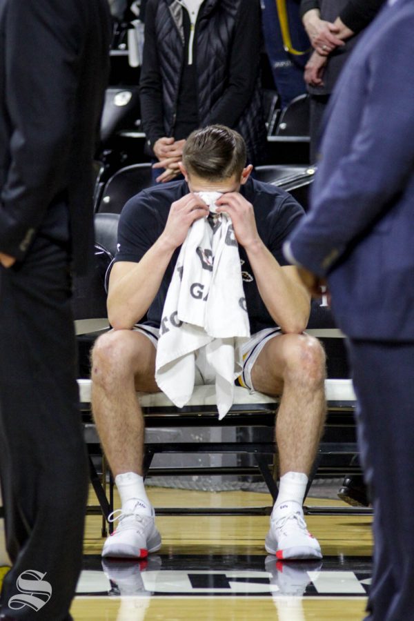 Wichita+State+sophomore+Erik+Stevenson+alone+on+the+bench+crying+prior+to+the+game+against+UT-Martin+on+Nov.+16+inside+Charles+Koch+Arena.+It+was+after+a+moment+of+silence+for+his+grandfather+who+died+this+past+Veterans+Day.