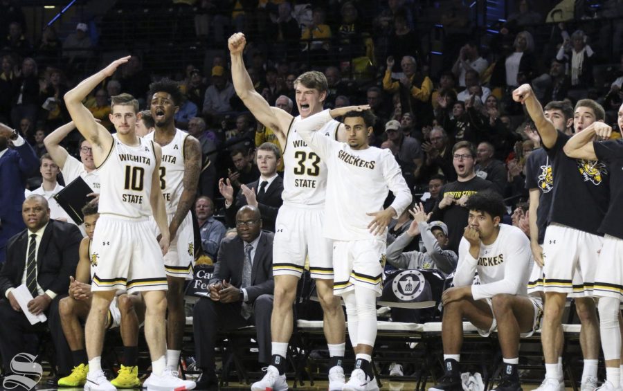 Wichita State players celebrate from the bench after scoring against Gardner-Webb on Tuesday, Nov. 19, 2019 at Charles Koch Arena. 