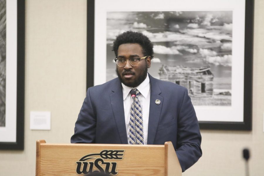 Senator Zachary James explains why he wants to become the out-of-state member of the Student Fees Committee during SGAs meeting on Wednesday. James, a sophomore political science major, is from Oklahoma.