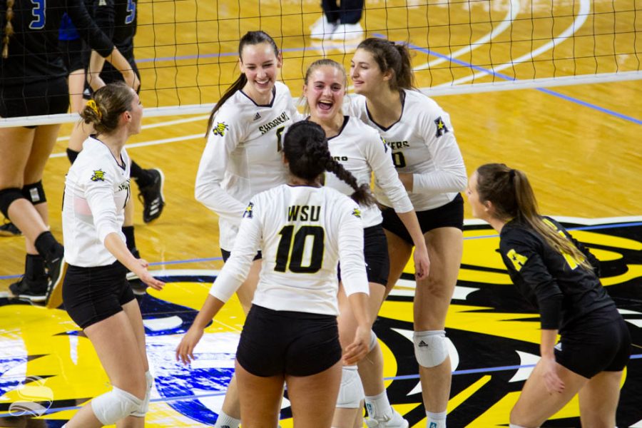 Wichita+State+freshman+Kayce+Litzau+celebrates+with+her+teammates+after+winning+a+point+during+the+match+against+Tulsa+on+Nov.+15+inside+Charles+Koch+Arena.