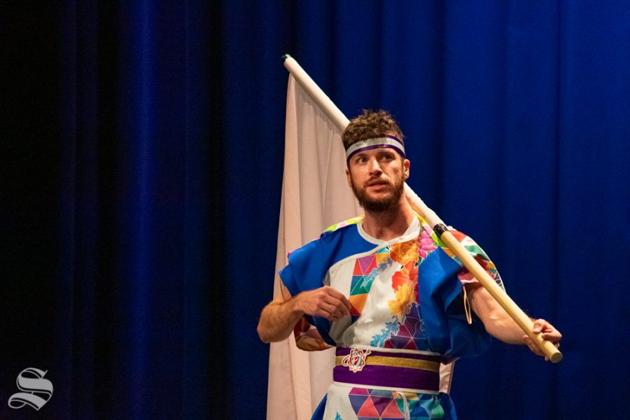 Ryan M. Kenny, a senior studying mechanical engineering at Kansas State, speaks to the crowd about the final dance that the Kansas State University Yosakoi Dancers will perform during Japanese Culture Night on Friday, Nov. 1 at the CAC Theater.