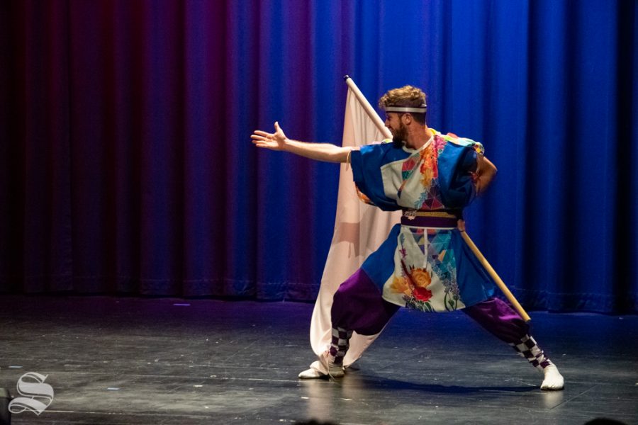 Ryan M. Kenny, a senior studying mechanical engineering at Kansas State, performs with the Kansas State University Yosakoi Dancers during Japanese Culture Night on Friday, Nov. 1 at the CAC Theater.