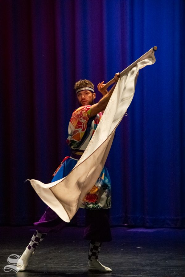 Ryan M. Kenny, a senior studying mechanical engineering at Kansas State, performs with the Kansas State University Yosakoi Dancers during Japanese Culture Night on Friday, Nov. 1 at the CAC Theater.