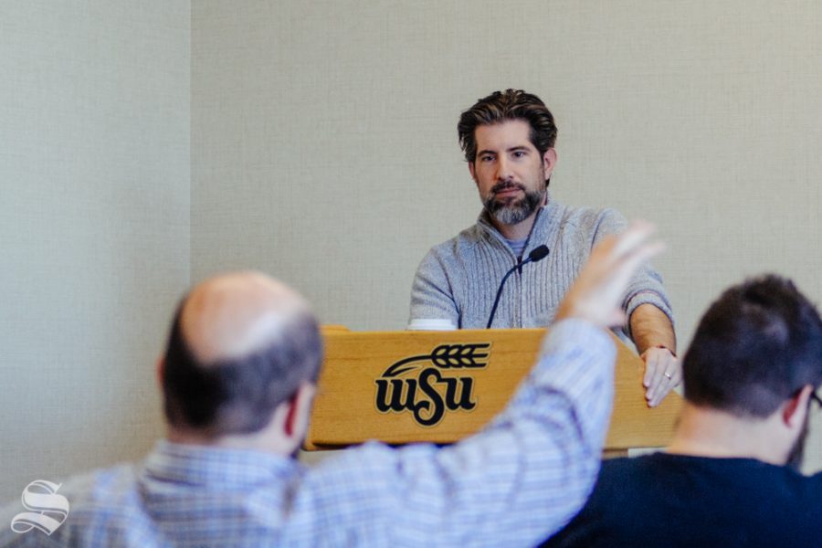 Lawyer Christopher McHugh looks to political science professor Neal Allen while he asks McHugh about a hypothetical case similar to the one involving samples from the Apollo 11 moon landing on Thursday, Nov. 7 in the Rhatigan Student Center.