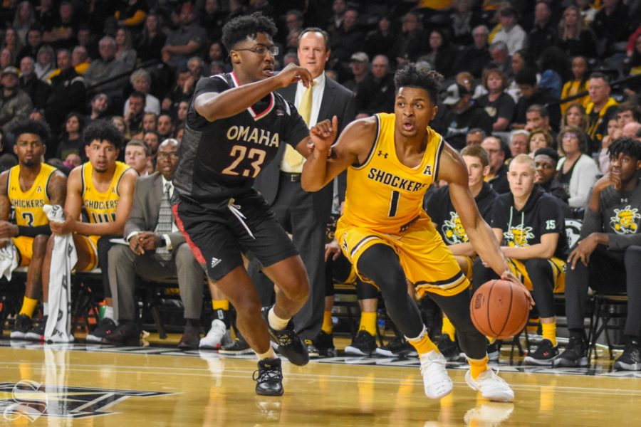 Freshman Tyson Etienne drives to the basket for a shot during the game against the Mavericks on Tuesday in Charles Koch Arena.