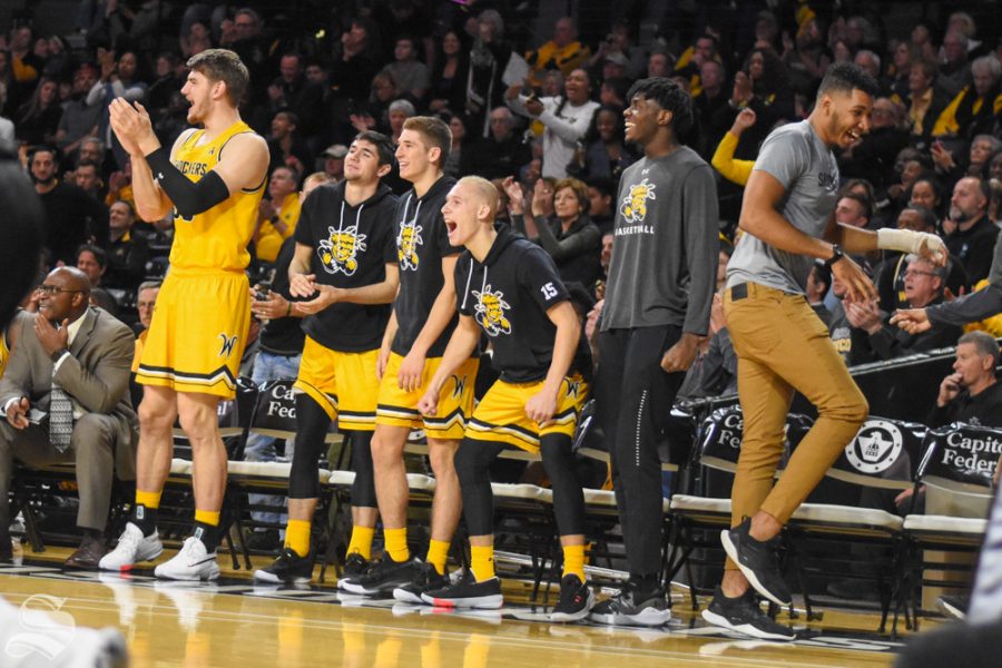 The Wichita State bench celebrates after scoring against the Omaha Mavericks on Tuesday in Charles Koch Arena.