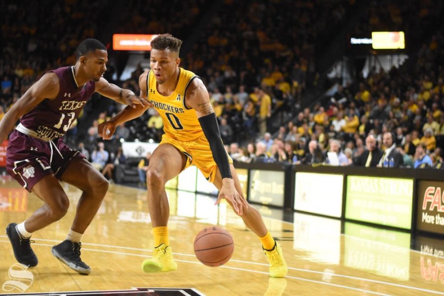 Wichita State sophomore Dexter Dennis drives past a Texas Southern defender during the first half of the game against the Tigers on Saturday inside Charles Koch Arena.