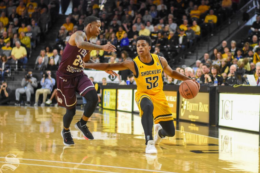 Wichita State freshman Grant Sherfield dribbles to the three-point line during the game against Texas Southern on Saturday in Charles Koch Arena.
