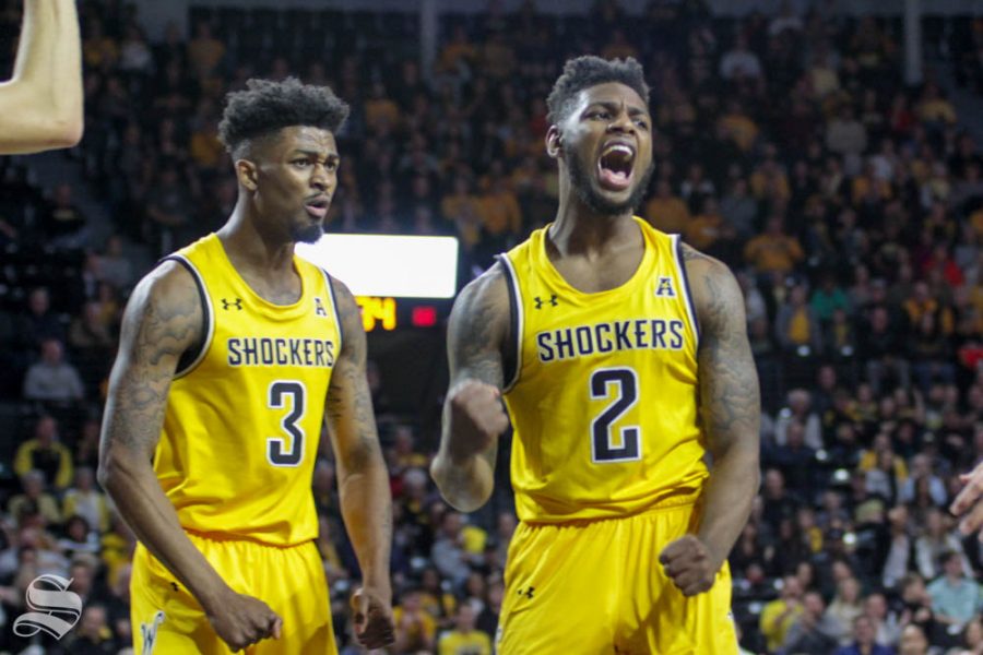 Wichita States Jamarius Burton and DeAntoni Gordon celebrate after Burton was fouled during a shot that went in during the first half of the game Thursday against Central Arkansas insider Charles Koch Arena.