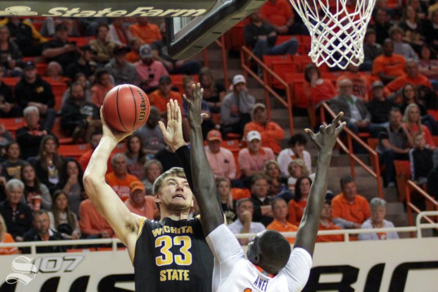 Wichita State junior Asbjørn Midtgaard shoots a hook shot during the second half of the game against Oklahoma State on Sunday inside Gallagher-Iba Arena.