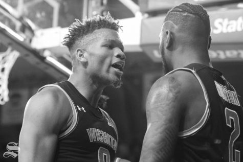 Wichita State sophomores Dexter Dennis and Jamarius Burton celebrate after Burton made a layup and was fouled during the Shocker's home win against Memphis in January.