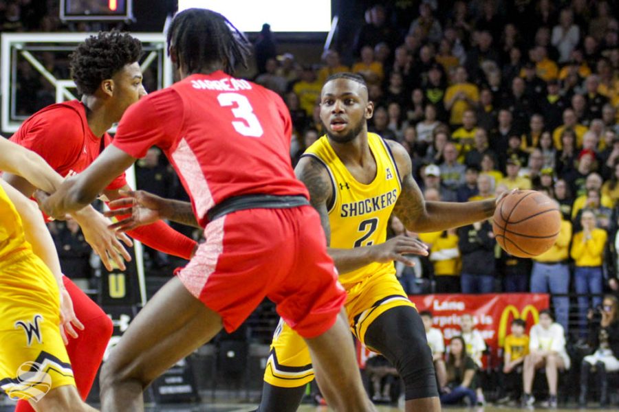 Wichita+State+sophomore+Jamarius+Burton+dribbles+at+the+top+of+the+key+during+the+first+half+of+the+game+against+Houston+on+Saturday+inside+Charles+Koch+Arena.