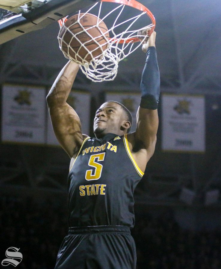 Wichita States Trey Wade dunks on Memphis during the game at Koch Arena on Thursday, Jan. 9, 2019.