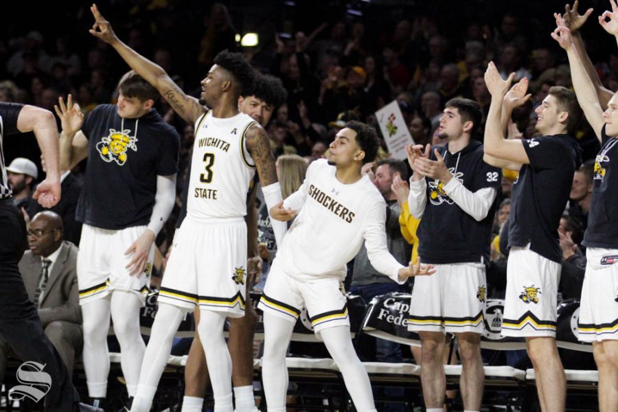 The Wichita State bench celebrates after a made three-pointer during the second half of the game against Central Florida on Jan. 25 inside Charles Koch Arena.