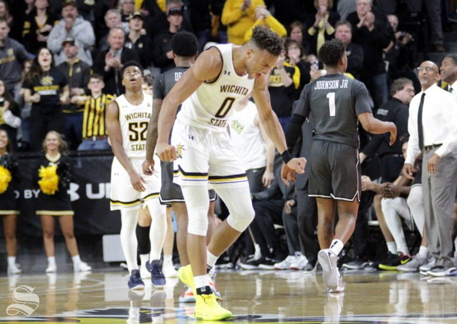 Wichita State sophomore Dexter Dennis celebrates after UCF calls a timeout during the second half of the game against Central Florida on Jan. 25 inside Charles Koch Arena.