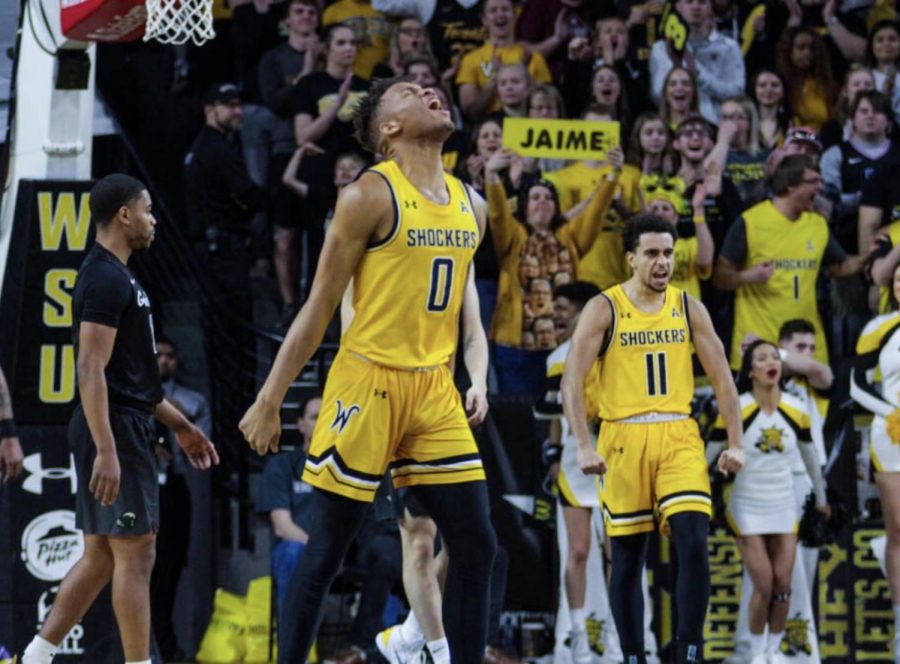 Wichita State’s Dexter Dennis (center) and Noah Fernandes (right) celebrate during Wichita State’s victory over Tulane Sunday at Charles Koch Arena.