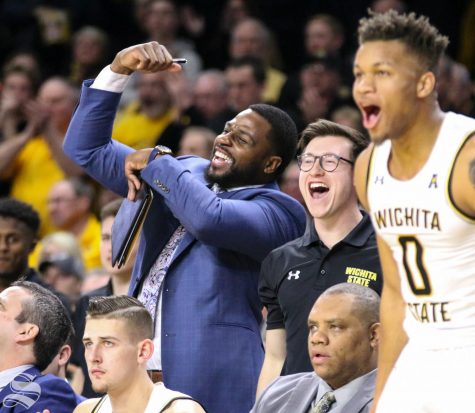 Wichita State graduate manager Ben Smith celebrates from the bench during the game against Cincinnati at Charles Koch Arena on Thursday, Feb. 6, 2020. 