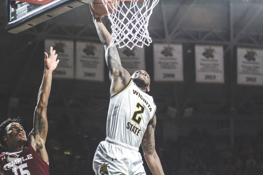 Wichita State sophomore Jamarius Burton dunks the ball during the first half of the game against Temple on Feb. 27 inside Charles Koch Arena.